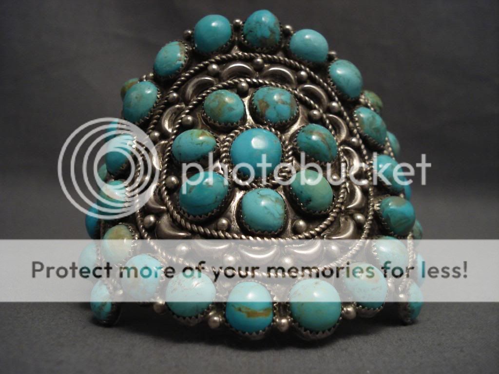   collection of rare domed shaped turquoise stones appearing to have