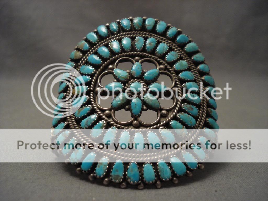   this bracelet has a huge cluster of blue gem turquoise stones the